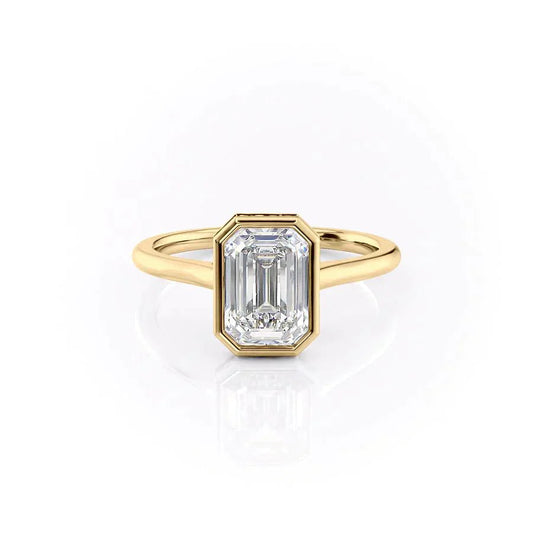 The Charlotte. A Yellow Gold Vintage, Solitaire, Hidden Halo, Bezel Engagement Ring Set With A 2ct Emerald Lab Grown Diamond. White Background.