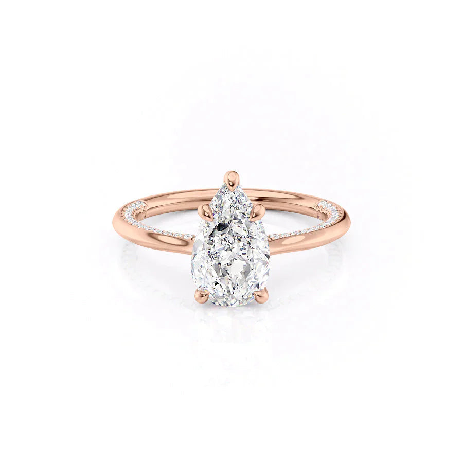 The Claire. A Rose Gold Solitaire, Pave Engagement Ring Set With A 2ct Pear Lab Grown Diamond. White Background.