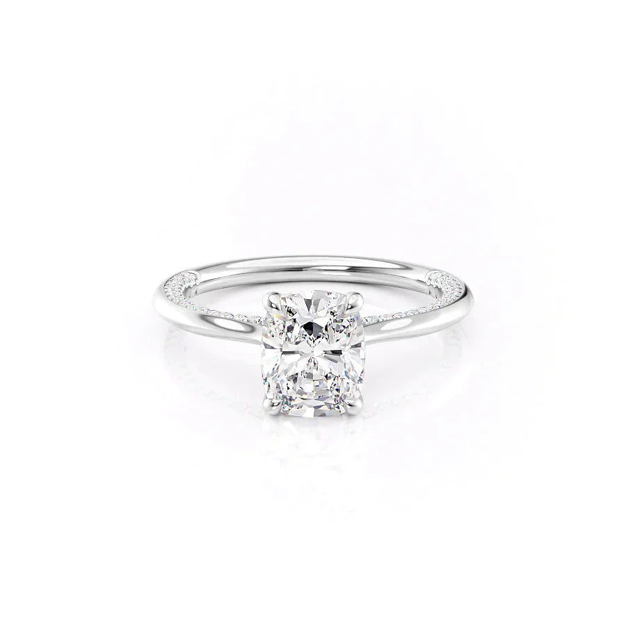 The Claire. A White Gold Solitaire, Pave Engagement Ring Set With A 2ct Elongated Cushion Lab Grown Diamond. White Background.