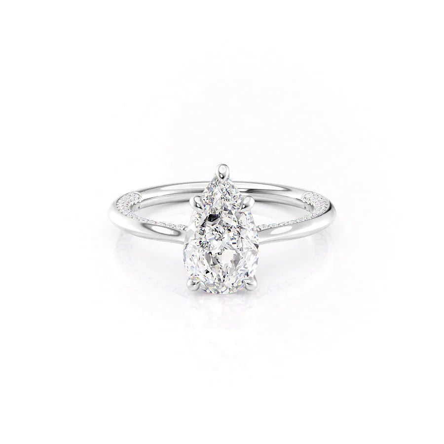 The Claire. A White Gold Solitaire, Pave Engagement Ring Set With A 2ct Pear Lab Grown Diamond. White Background.
