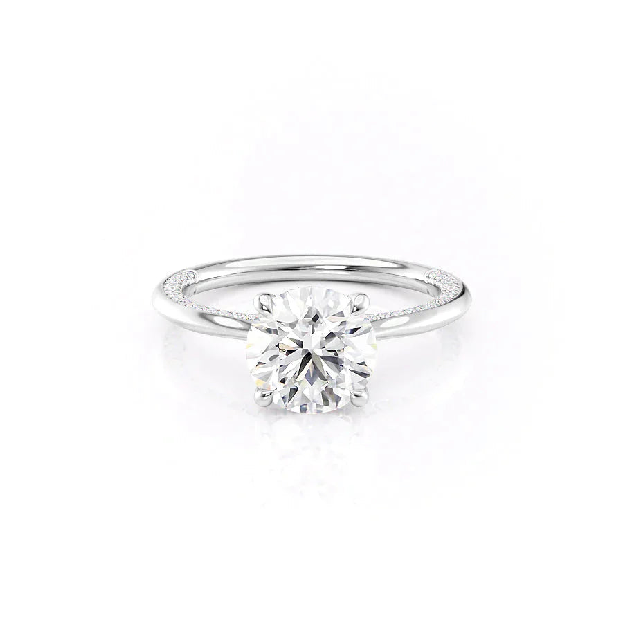 The Claire. A White Gold Solitaire, Pave Engagement Ring Set With A 2ct Round Lab Grown Diamond. White Background.