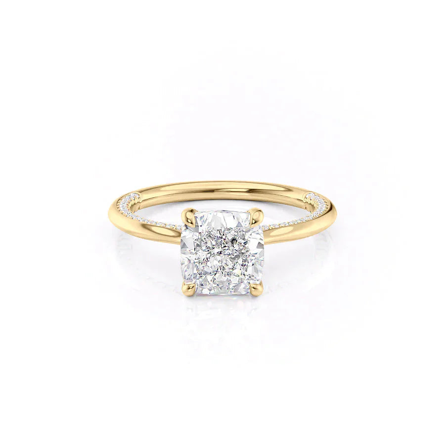 The Claire. A Yellow Gold Solitaire, Pave Engagement Ring Set With A 2ct Cushion Lab Grown Diamond. White Background.