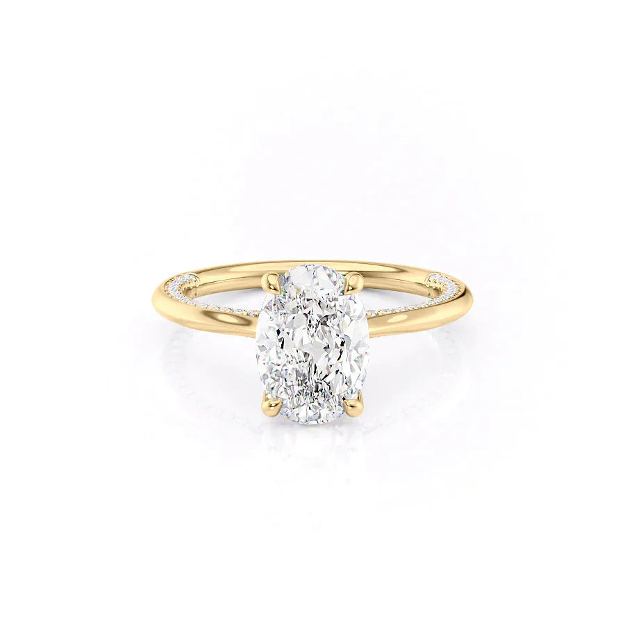 The Claire. A Yellow Gold Solitaire, Pave Engagement Ring Set With A 2ct Oval Lab Grown Diamond. White Background.