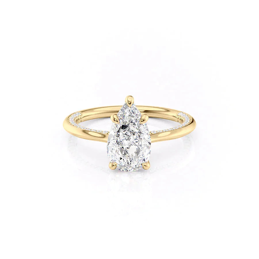 The Claire. A Yellow Gold Solitaire, Pave Engagement Ring Set With A 2ct Pear Lab Grown Diamond. White Background.