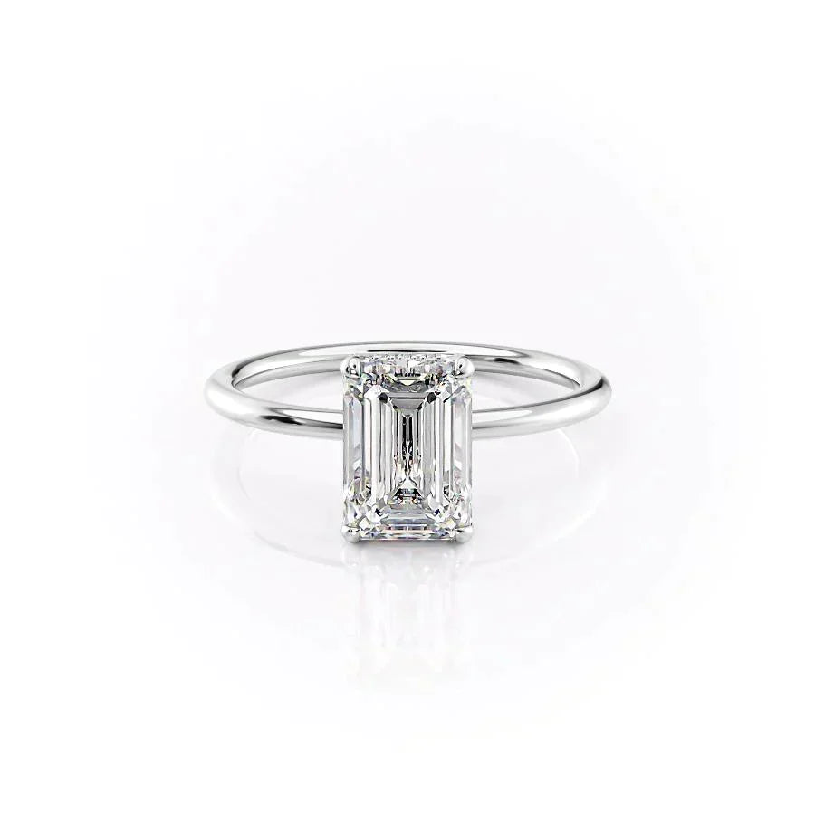 The Crown Kamellie. A White Gold Solitaire, Hidden Halo Engagement Ring Set With A 2ct Emerald Lab Grown Diamond. White Background.