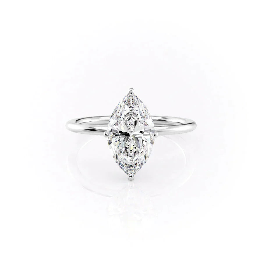 The Crown Kamellie. A White Gold Solitaire, Hidden Halo Engagement Ring Set With A 2ct Marquise Lab Grown Diamond. White Background.