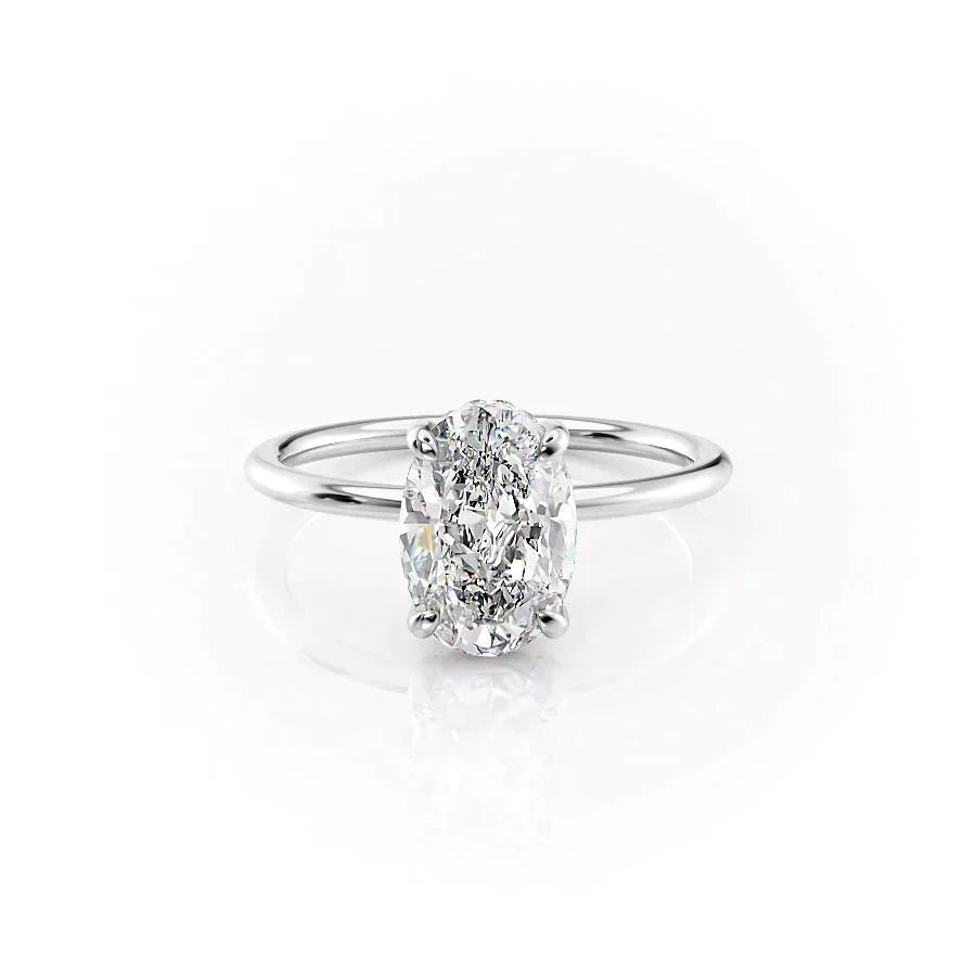 The Crown Kamellie. A White Gold Solitaire, Hidden Halo Engagement Ring Set With A 2ct Oval Lab Grown Diamond. White Background.