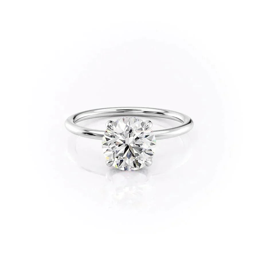 The Crown Kamellie. A White Gold Solitaire, Hidden Halo Engagement Ring Set With A 2ct Round Lab Grown Diamond. White Background.