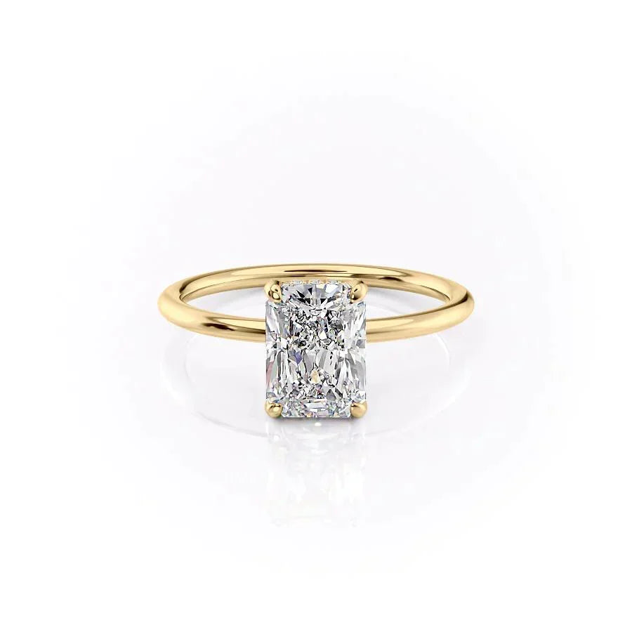 The Crown Kamellie. A Yellow Gold Solitaire, Hidden Halo Engagement Ring Set With A 2ct Radiant Lab Grown Diamond. White Background.