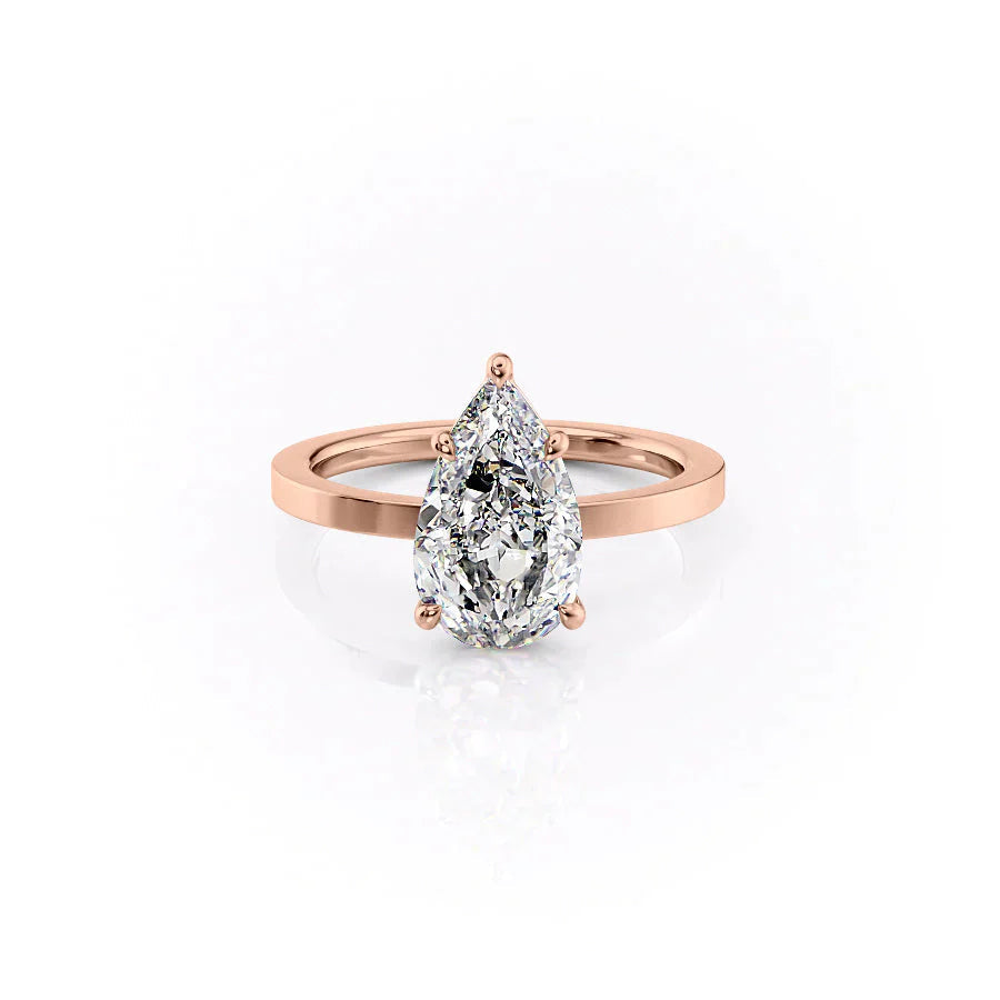 The Eleanor. A Rose Gold Solitaire Engagement Ring Set With A 2ct Pear Lab Grown Diamond. White Background.