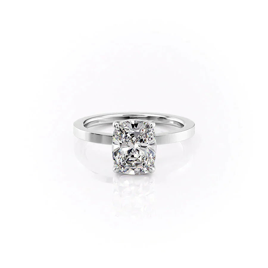 The Eleanor. A White Gold Solitaire Engagement Ring Set With A 2ct Elongated Cushion Lab Grown Diamond. White Background.