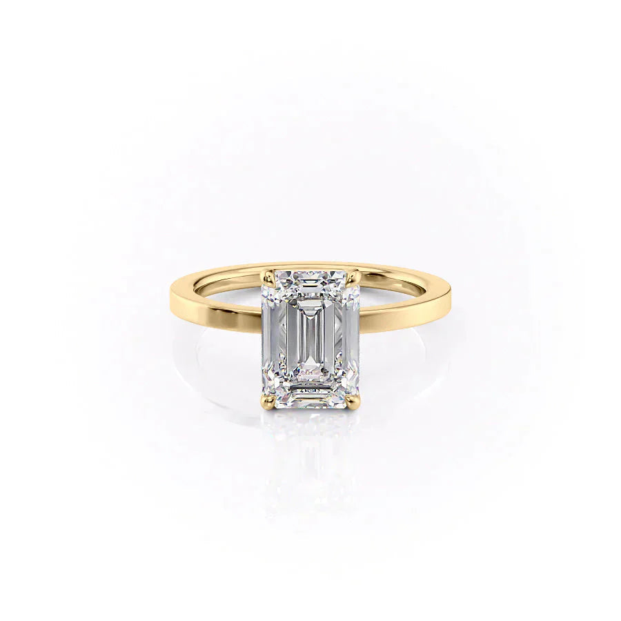 The Eleanor. A Yellow Gold Solitaire Engagement Ring Set With A 2ct Emerald Lab Grown Diamond. White Background.