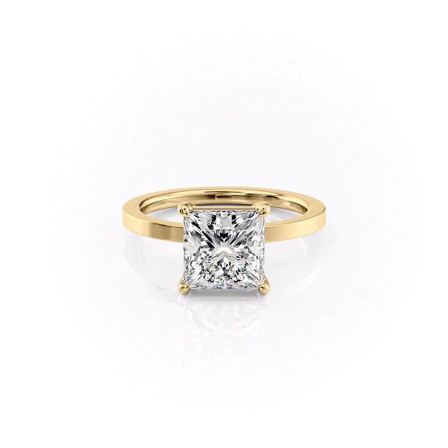 The Eleanor. A Yellow Gold Solitaire Engagement Ring Set With A 2ct Princess Lab Grown Diamond. White Background.