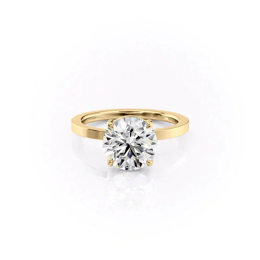 The Eleanor. A Yellow Gold Solitaire Engagement Ring Set With A 2ct Round Lab Grown Diamond. White Background.