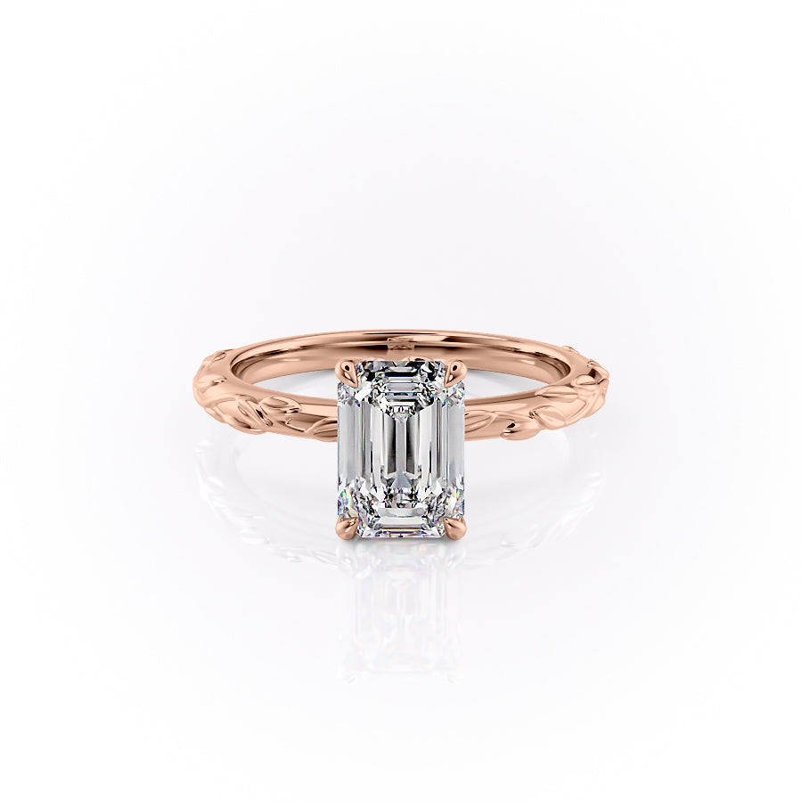The Flora. A Rose Gold Nature, Solitaire Engagement Ring Set With A 2ct Emerald Lab Grown Diamond. White Background.