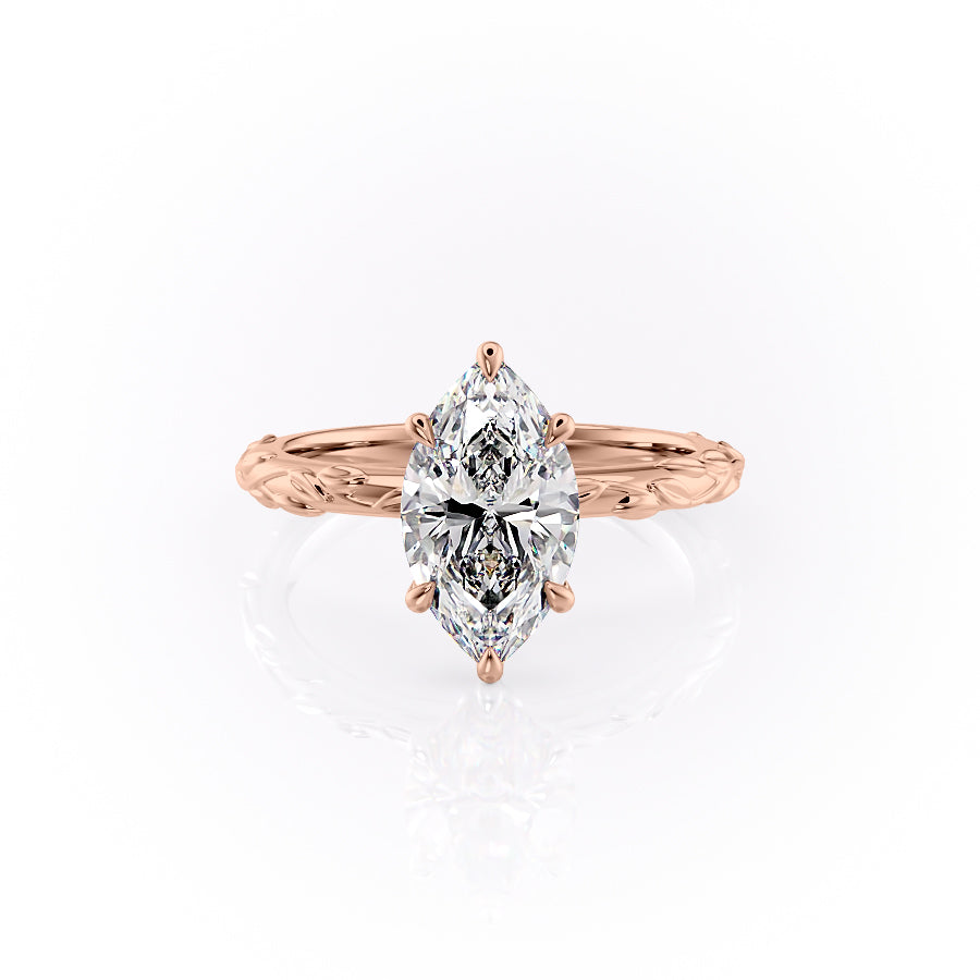 The Flora. A Rose Gold Nature, Solitaire Engagement Ring Set With A 2ct Marquise Lab Grown Diamond. White Background.
