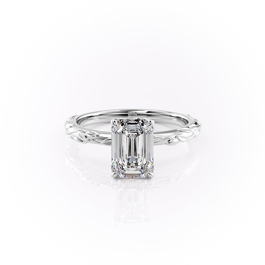 The Flora. A White Gold Nature, Solitaire Engagement Ring Set With A 2ct Emerald Lab Grown Diamond. White Background.