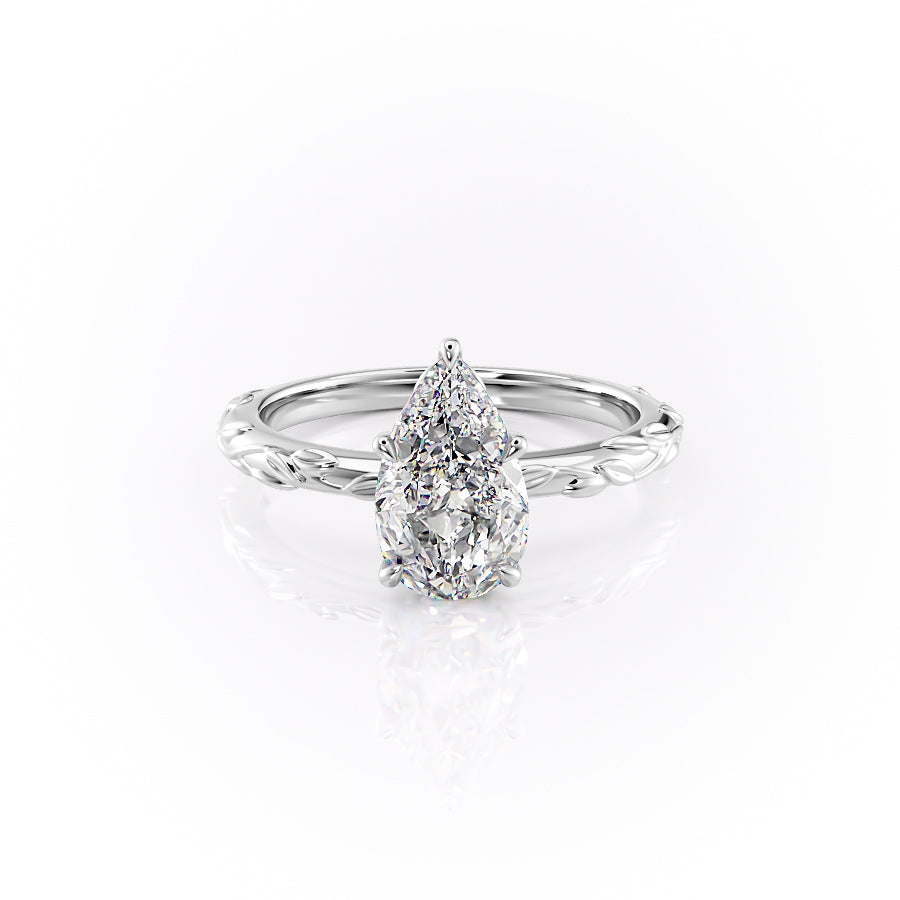 The Flora. A White Gold Nature, Solitaire Engagement Ring Set With A 2ct Pear Lab Grown Diamond. White Background.