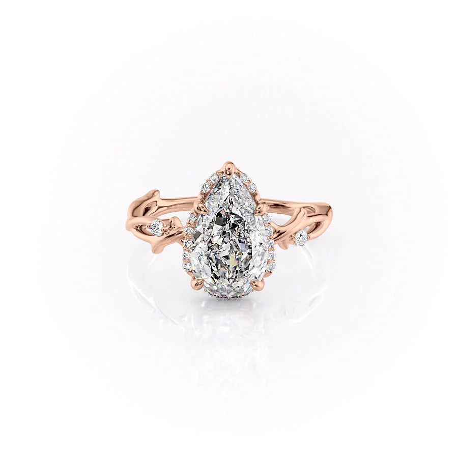 The Halo Twig. A Rose Gold Nature Engagement Ring Set With A 2ct Pear Lab Grown Diamond. White Background.