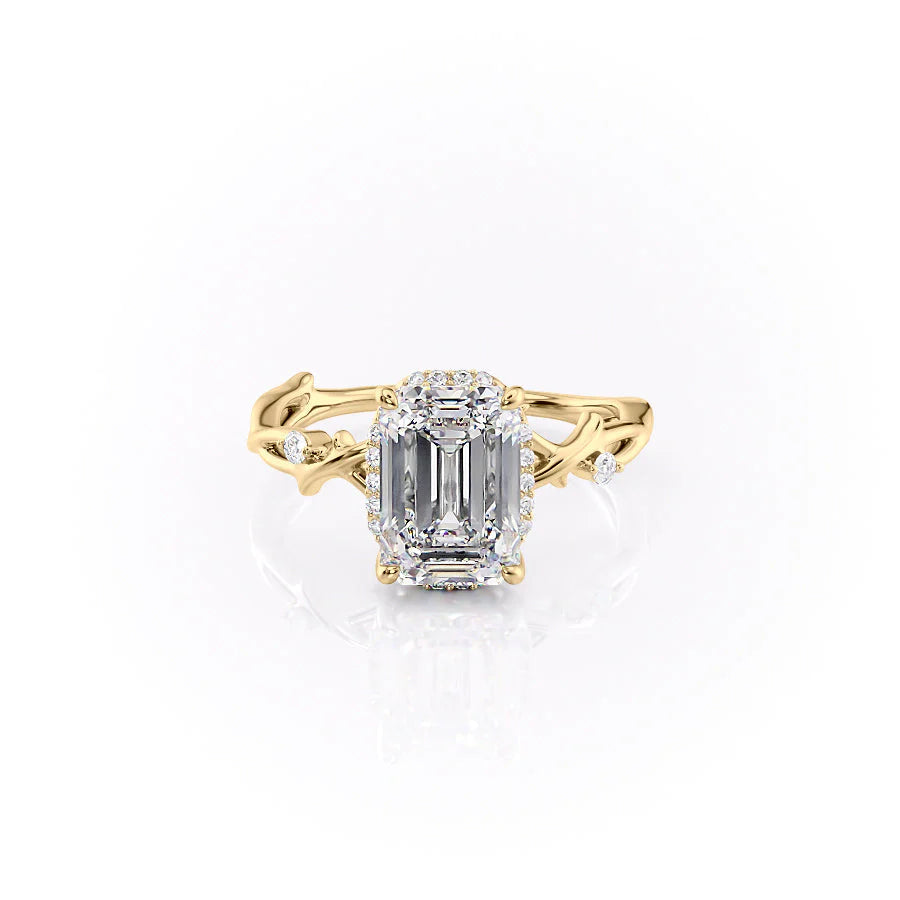 The Halo Twig. A Yellow Gold Nature Engagement Ring Set With A 2ct Emerald Lab Grown Diamond. White Background.
