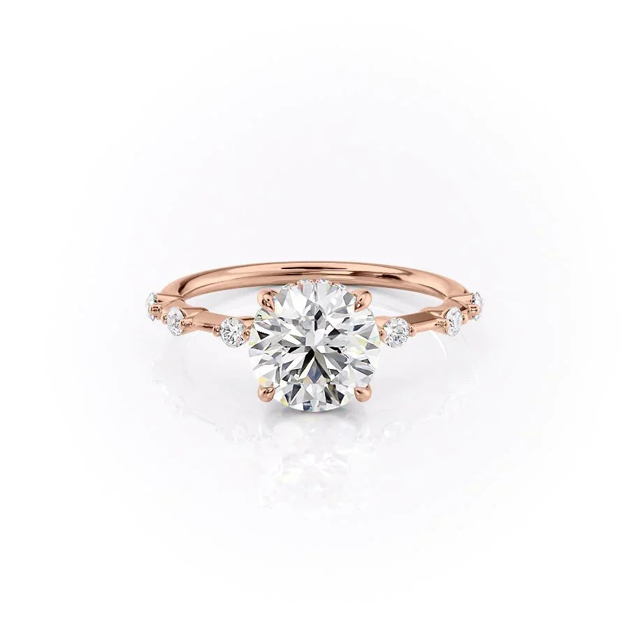 The Hidden Halo Penelope. A Rose Gold Side Stones Engagement Ring Set With A 2ct Round Lab Grown Diamond. White Background.