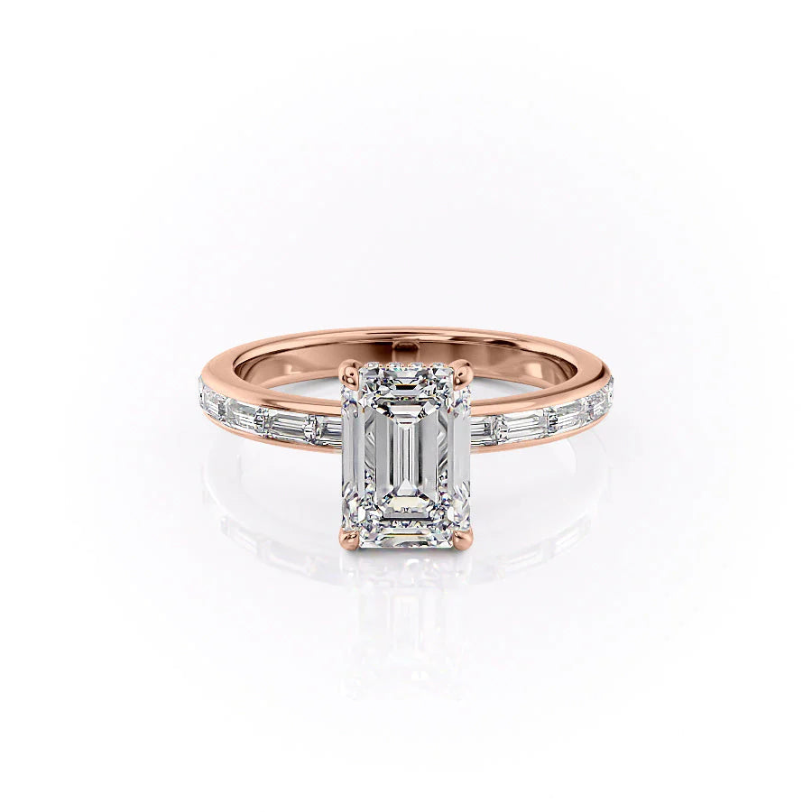 The Jennifer. A Rose Gold Channel-Set, Side Stones, Hidden Halo Engagement Ring Set With A 2ct Emerald Lab Grown Diamond. White Background.
