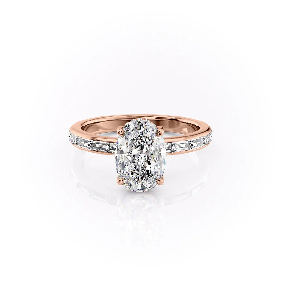 The Jennifer. A Rose Gold Channel-Set, Side Stones, Hidden Halo Engagement Ring Set With A 2ct Oval Lab Grown Diamond. White Background.