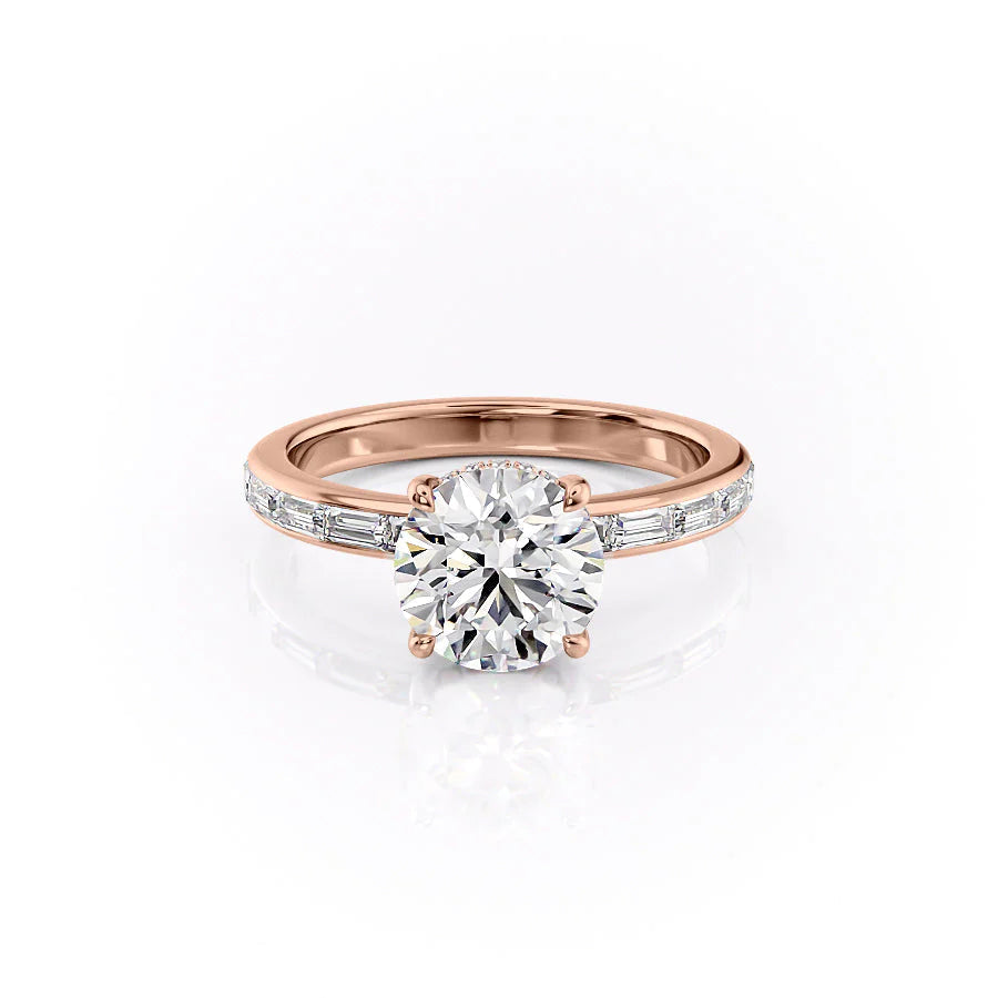 The Jennifer. A Rose Gold Channel-Set, Side Stones, Hidden Halo Engagement Ring Set With A 2ct Round Lab Grown Diamond. White Background.
