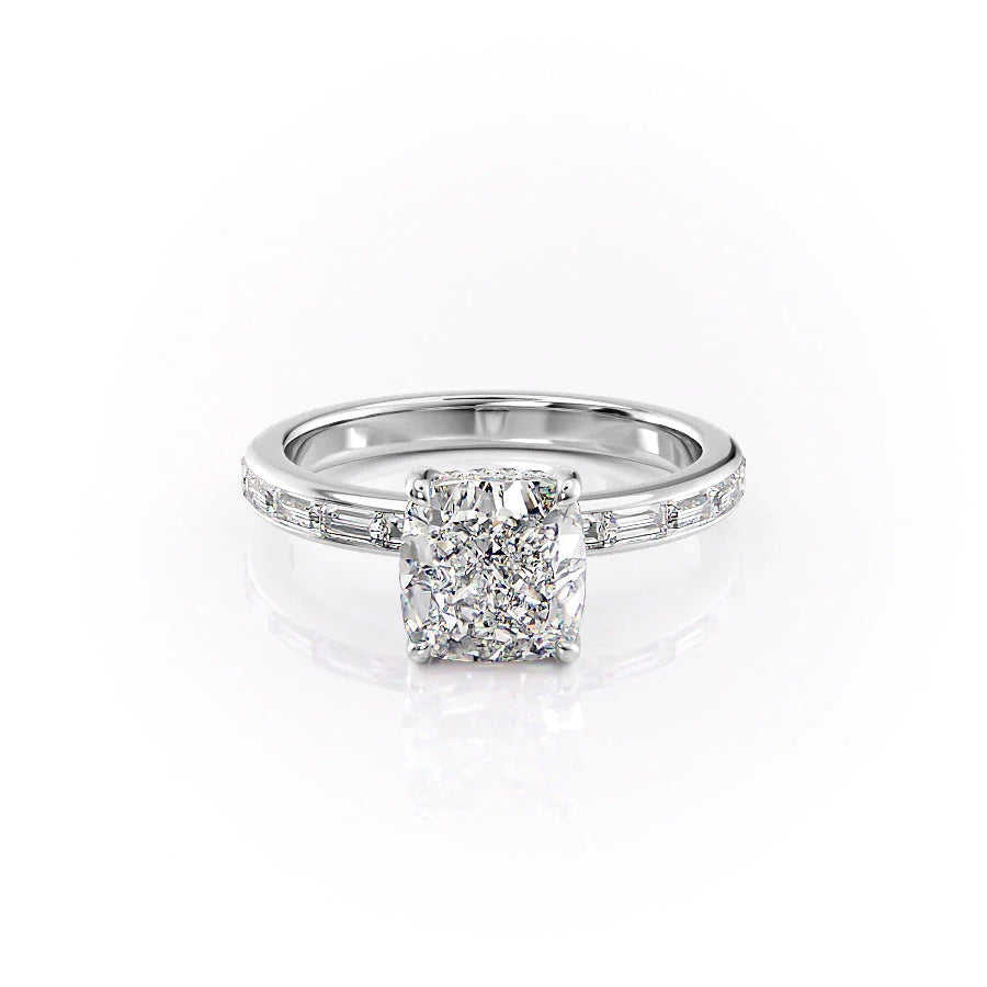 The Jennifer. A White Gold Channel-Set, Side Stones, Hidden Halo Engagement Ring Set With A 2ct Cushion Lab Grown Diamond. White Background.