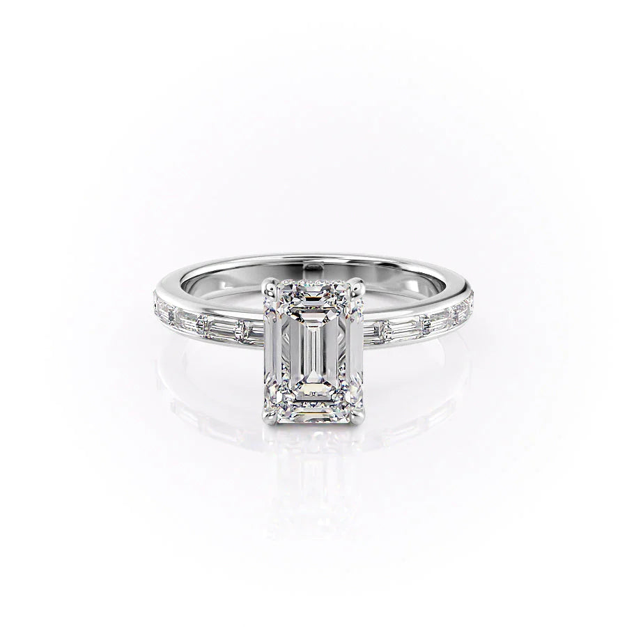 The Jennifer. A White Gold Channel-Set, Side Stones, Hidden Halo Engagement Ring Set With A 2ct Emerald Lab Grown Diamond. White Background.