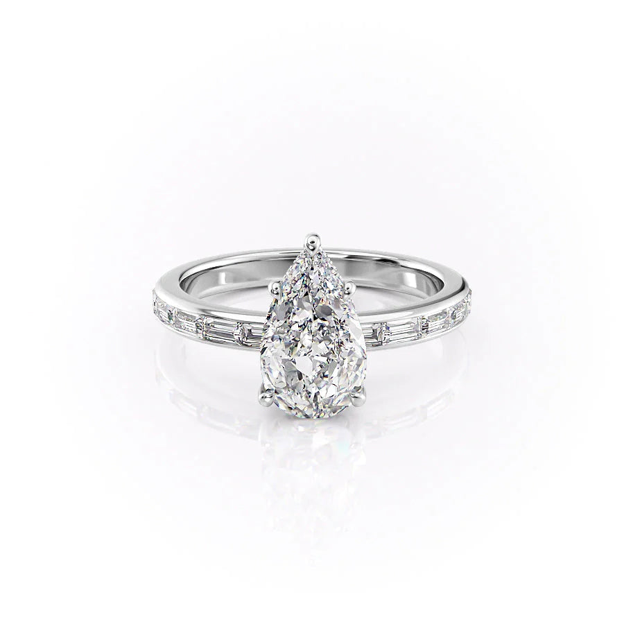 The Jennifer. A White Gold Channel-Set, Side Stones, Hidden Halo Engagement Ring Set With A 2ct Pear Lab Grown Diamond. White Background.