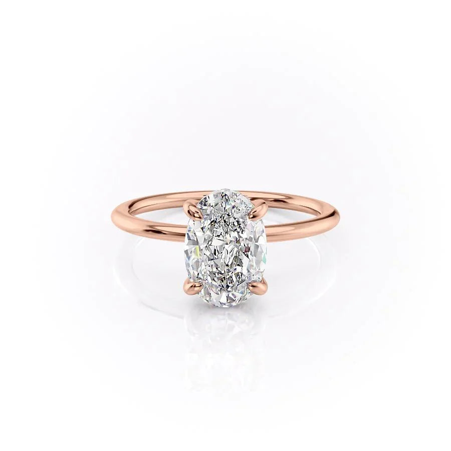 The Kamellie. A Rose Gold Solitaire, Hidden Halo Engagement Ring Set With A 2ct Oval Lab Grown Diamond. White Background.