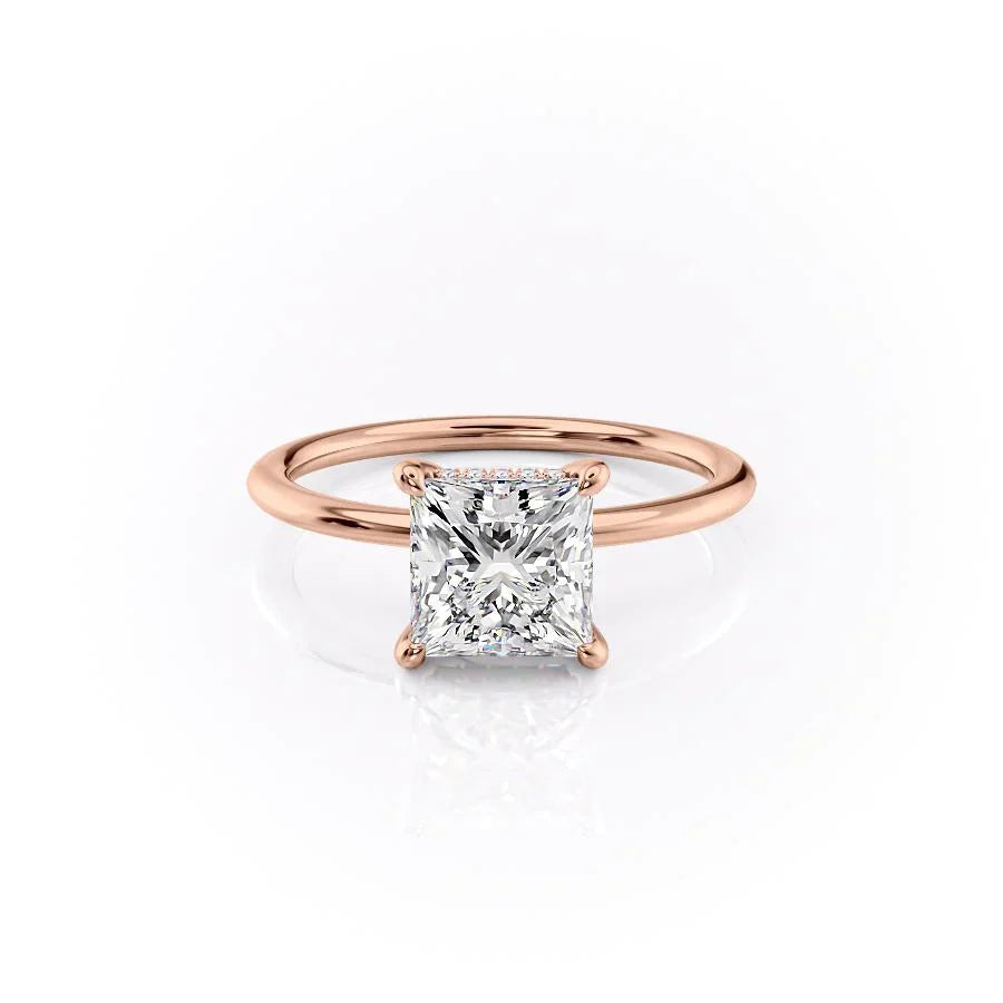 The Kamellie. A Rose Gold Solitaire, Hidden Halo Engagement Ring Set With A 2ct Princess Lab Grown Diamond. White Background.