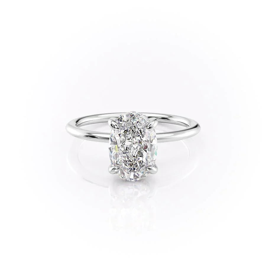 The Kamellie. A White Gold Solitaire, Hidden Halo Engagement Ring Set With A 2ct Oval Lab Grown Diamond. White Background.