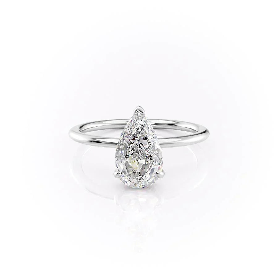The Kamellie. A White Gold Solitaire, Hidden Halo Engagement Ring Set With A 2ct Pear Lab Grown Diamond. White Background.