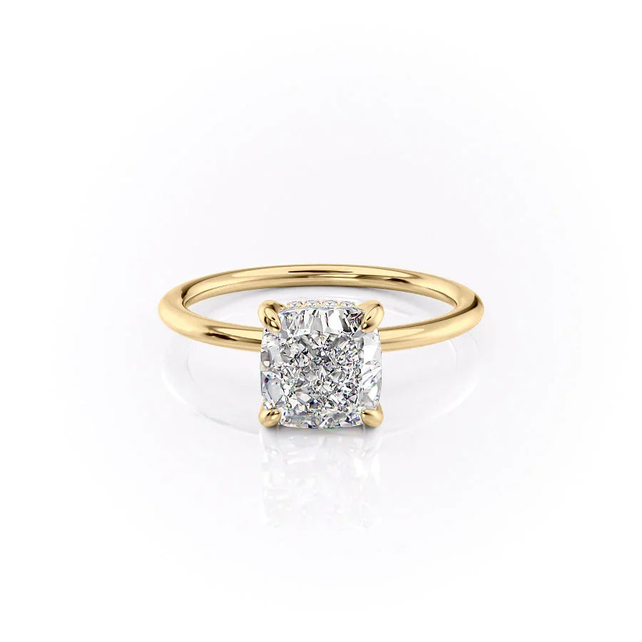 The Kamellie. A Yellow Gold Solitaire, Hidden Halo Engagement Ring Set With A 2ct Cushion Lab Grown Diamond. White Background.
