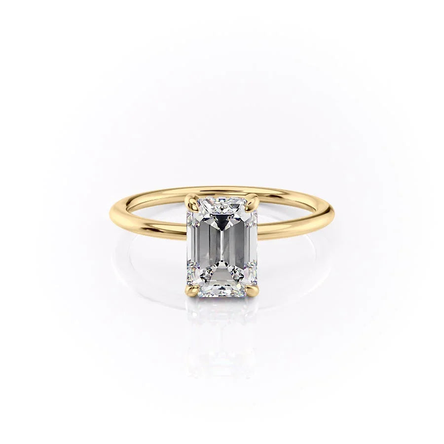 The Kamellie. A Yellow Gold Solitaire, Hidden Halo Engagement Ring Set With A 2ct Emerald Lab Grown Diamond. White Background.
