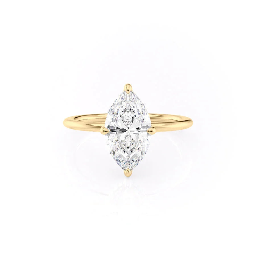 The Kamellie. A Yellow Gold Solitaire, Hidden Halo Engagement Ring Set With A 2ct Marquise Lab Grown Diamond. White Background.