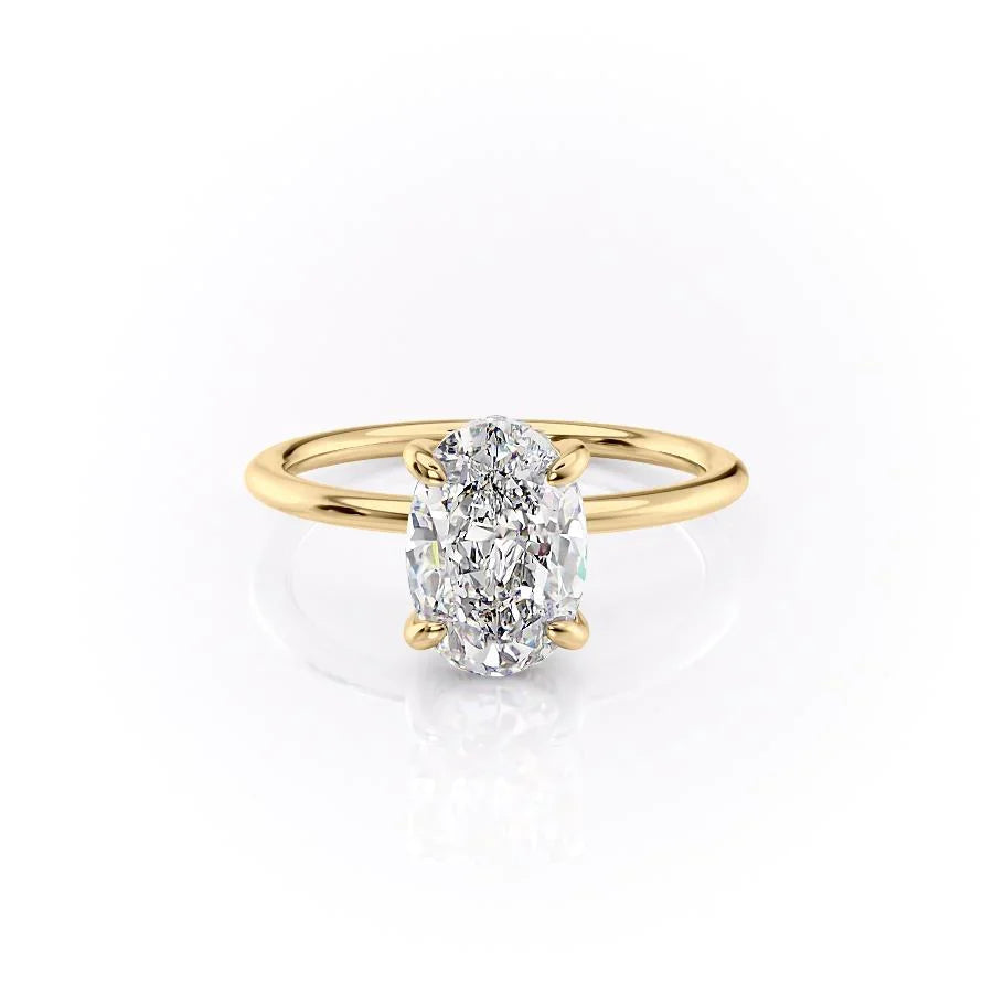The Kamellie. A Yellow Gold Solitaire, Hidden Halo Engagement Ring Set With A 2ct Oval Lab Grown Diamond. White Background.