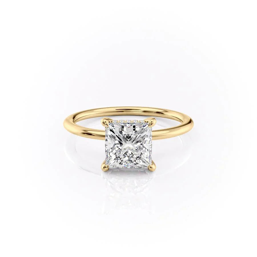 The Kamellie. A Yellow Gold Solitaire, Hidden Halo Engagement Ring Set With A 2ct Princess Lab Grown Diamond. White Background.