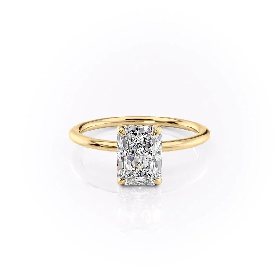 The Kamellie. A Yellow Gold Solitaire, Hidden Halo Engagement Ring Set With A 2ct Radiant Lab Grown Diamond. White Background.