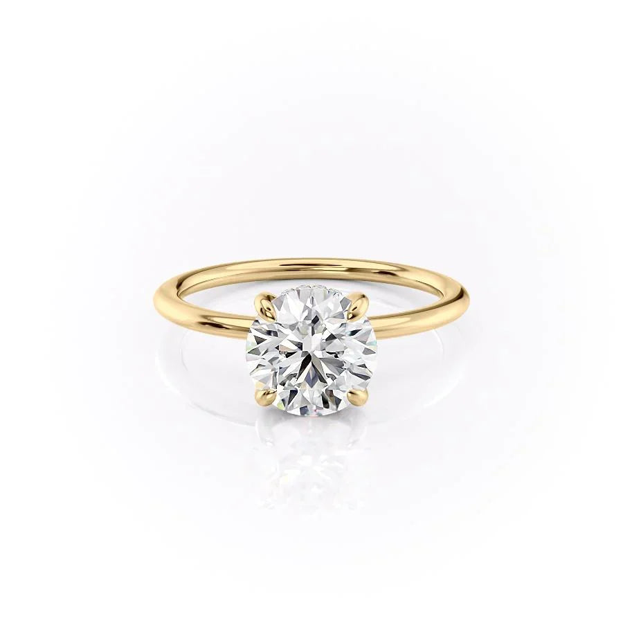 The Kamellie. A Yellow Gold Solitaire, Hidden Halo Engagement Ring Set With A 2ct Round Lab Grown Diamond. White Background.