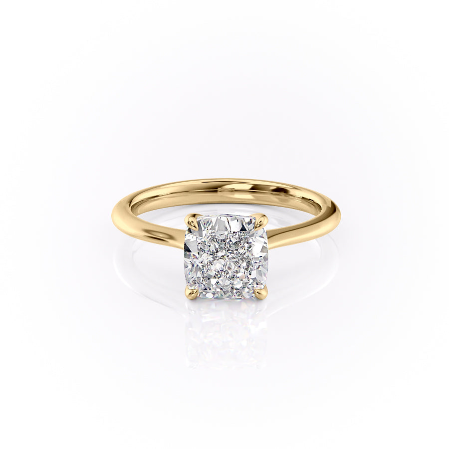 The Katelyn. A Yellow Gold Solitaire Engagement Ring Set With A 2ct Cushion Lab Grown Diamond. White Background.