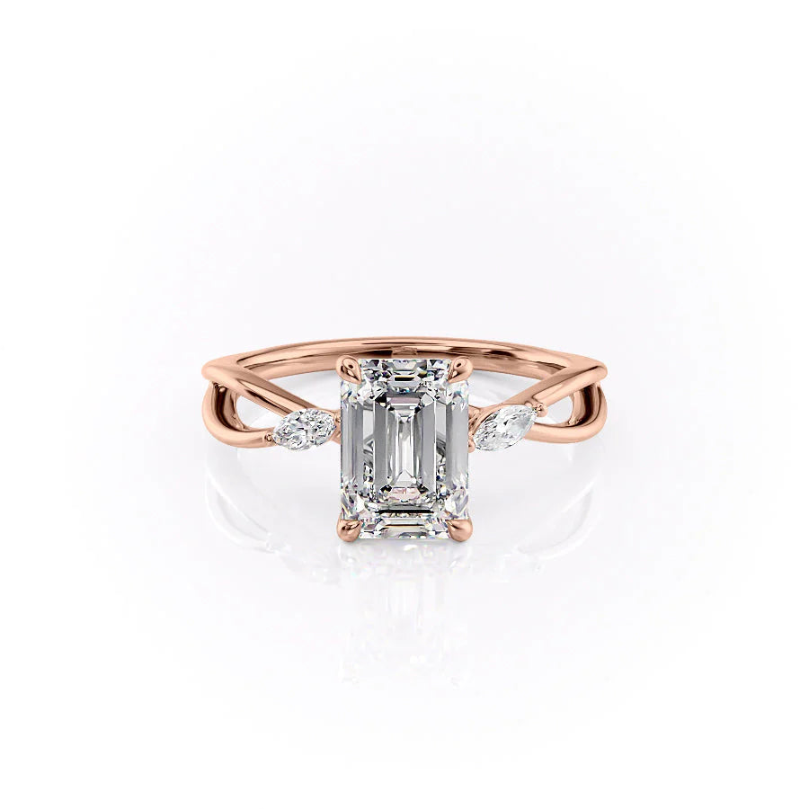 The Kelsey. A Rose Gold Side Stones Engagement Ring Set With A 2ct Emerald Lab Grown Diamond. White Background.