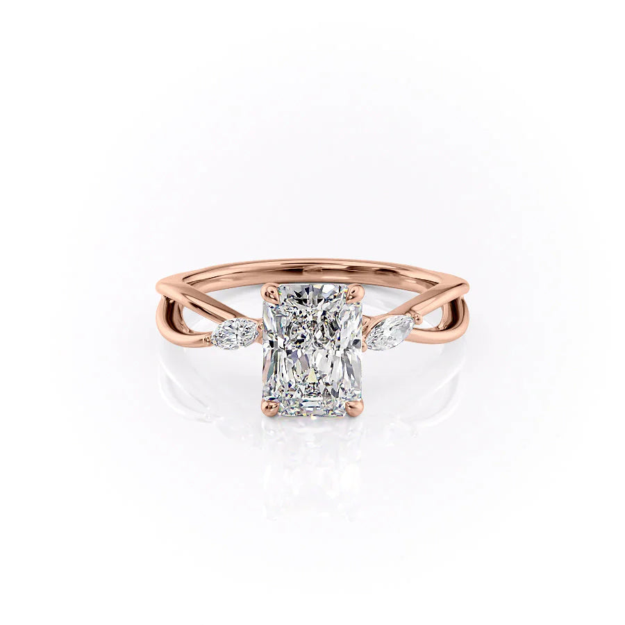 The Kelsey. A Rose Gold Side Stones Engagement Ring Set With A 2ct Radiant Lab Grown Diamond. White Background.