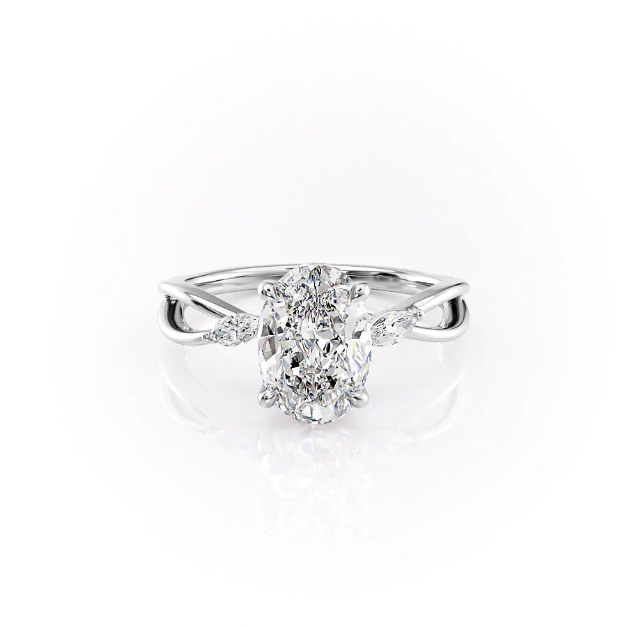 The Kelsey. A White Gold Side Stones Engagement Ring Set With A 2ct Oval Lab Grown Diamond. White Background.