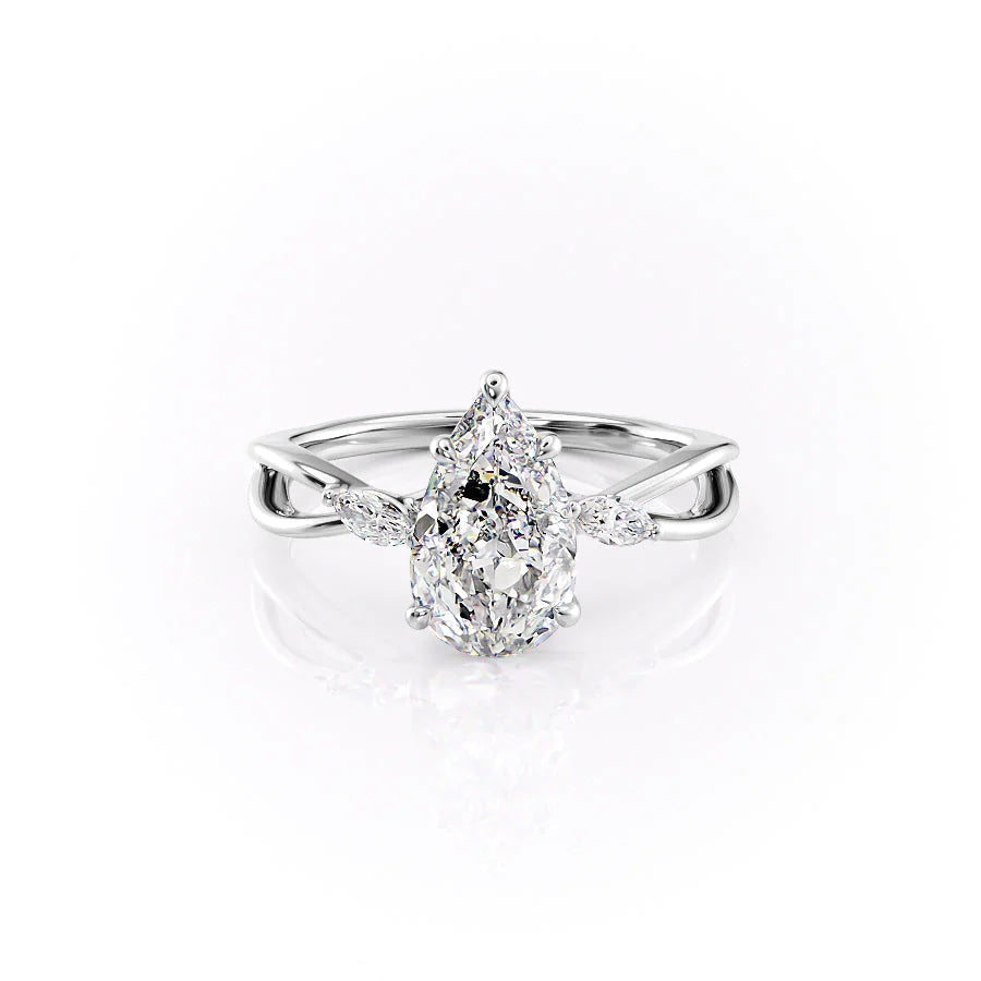 The Kelsey. A White Gold Side Stones Engagement Ring Set With A 2ct Pear Lab Grown Diamond. White Background.