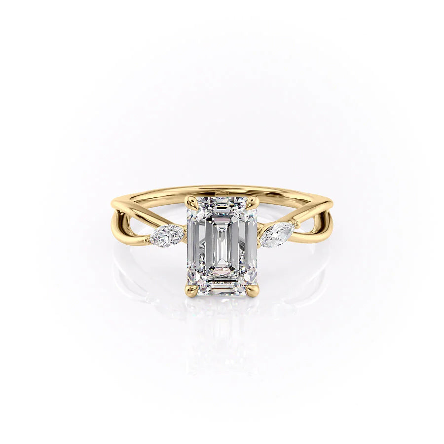 The Kelsey. A Yellow Gold Side Stones Engagement Ring Set With A 2ct Emerald Lab Grown Diamond. White Background.