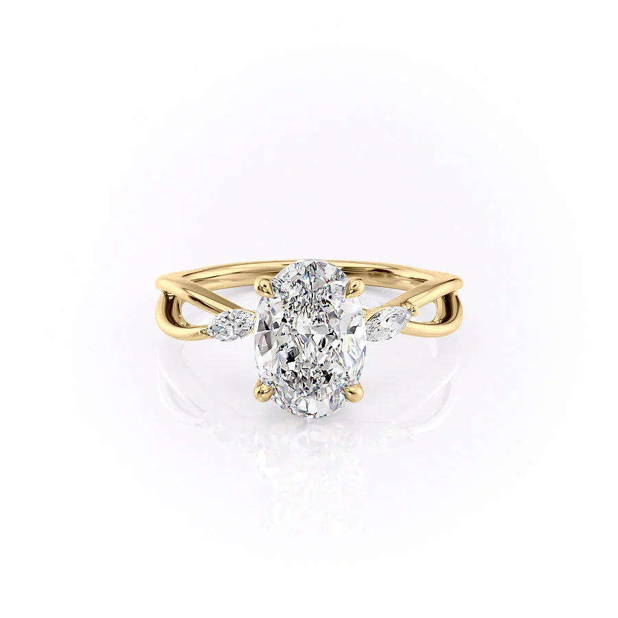 The Kelsey. A Yellow Gold Side Stones Engagement Ring Set With A 2ct Oval Lab Grown Diamond. White Background.