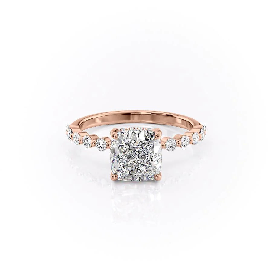 The Khloe. A Rose Gold Side Stones, Hidden Halo Engagement Ring Set With A 2ct Cushion Lab Grown Diamond. White Background.
